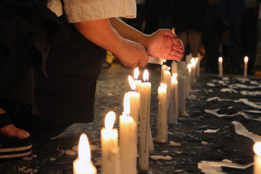 person holding candles with fire